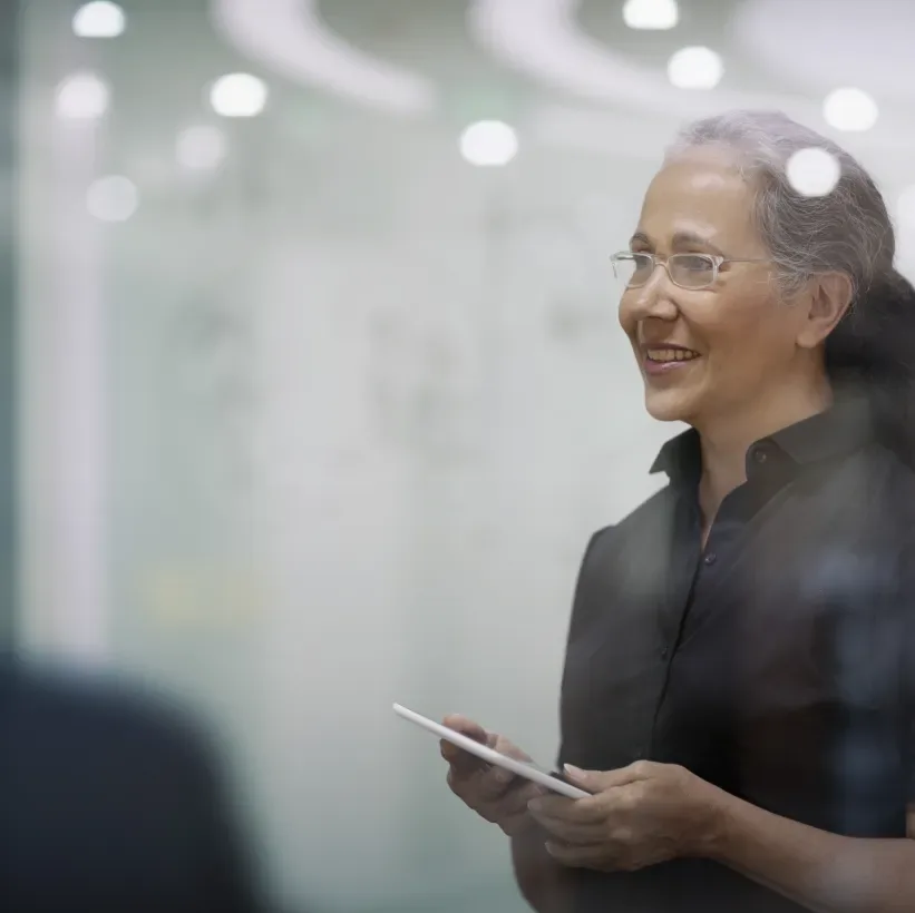 Woman holding tablet in an office