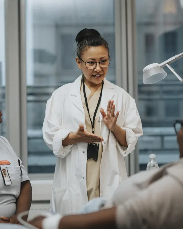 Female doctor speaking to a female patient during a visit