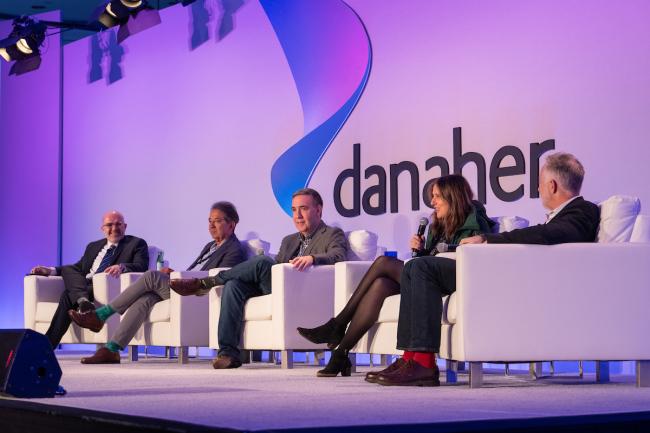 "Lost in translational AI" panel discussion on stage at the Danaher Summit