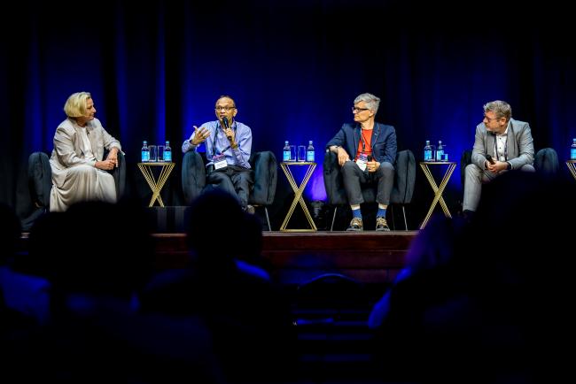 A discussion panel on stage at the 2026 Danaher Summit